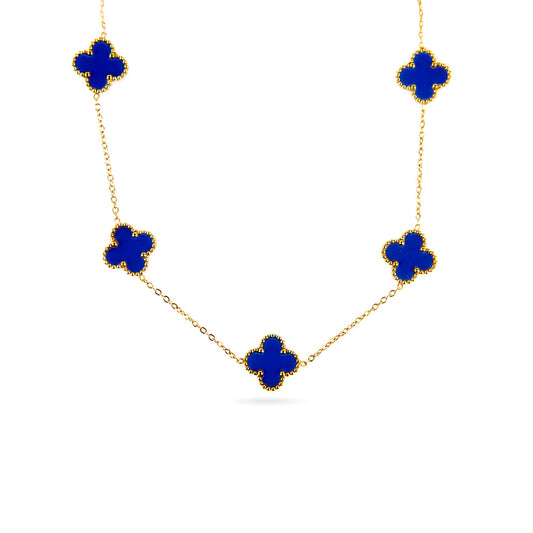 A studio shot on a white background displays the Aurora Clover Pendant. This gold-toned necklace features a delicate chain with five evenly spaced clover-shaped pendants, each filled with a vibrant blue enamel.
