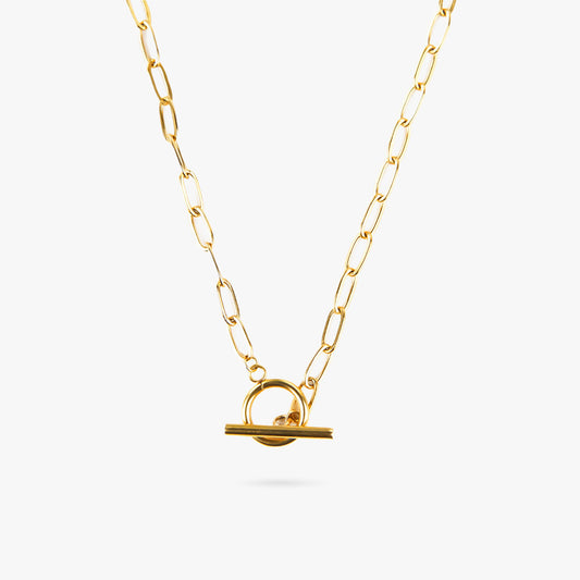 Elara Grace Pendant – Delta Jewel gold-plated chain necklace with elongated links and a circular toggle clasp pendant, displayed on a light background.