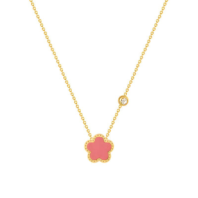 Gold necklace with coral flower pendant and diamond accent, adding elegance to any outfit.