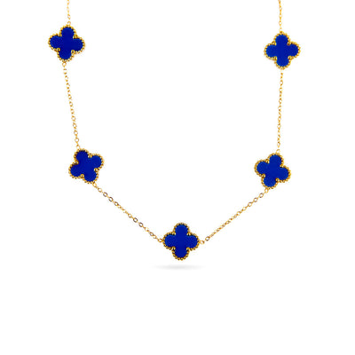 A studio shot on a white background displays the Aurora Clover Pendant. This gold-toned necklace features a delicate chain with five evenly spaced clover-shaped pendants, each filled with a vibrant blue enamel.