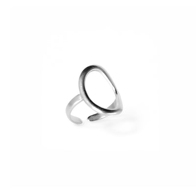 A studio shot on a pristine white background displays the Celeste Teardrop Ring. This silver-toned ring features a polished, fluid open teardrop shape on top, with an open-ended band for adjustability.