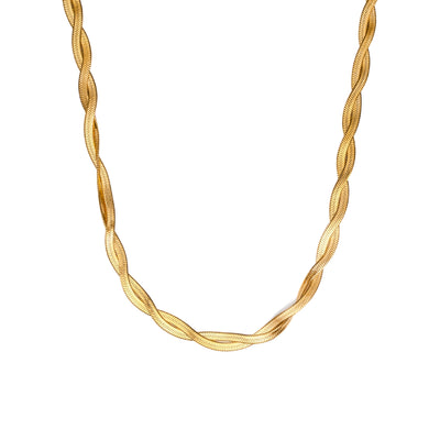 A close-up studio shot on a pure white background displays the Lumina Herringbone Twist Necklace. This gold-toned necklace features two flat, flexible herringbone chains intricately twisted together, creating a substantial and highly reflective, textured golden spiral.